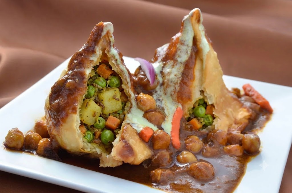 Vegetable Samosas at Copper Chimney Winnipeg - crispy pastry with spiced potato and pea filling